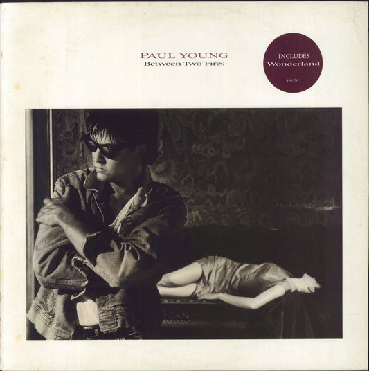 Paul Young Between Two Fires - Promo Stamped Sleeve UK Vinyl LP